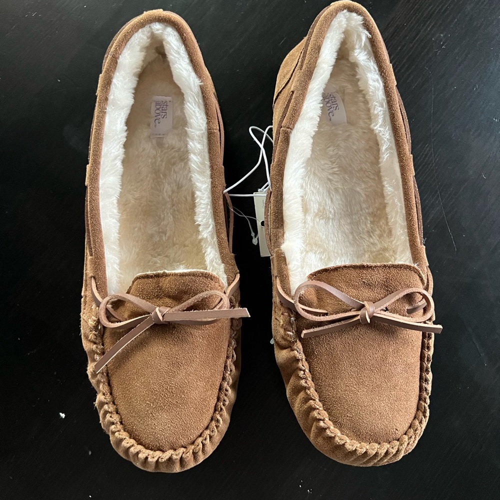 Star above moccasin slippers